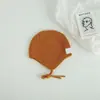 Bonitos y adorables gorros de otoño e invierno para niños, con diseño de poner, material de punto y una serie de dibujos animados, que brindan abrigo y protección para los oídos para bebés y niños pequeños.