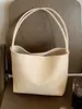 Bolso de axila de nicho de alta gama para mujer 2026 Nuevo Verano Súper Caliente Exquisito Bolso tipo cubo de un solo hombro para axila
