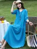 Vestido de algodão e seda brilhante e estiloso para viagem a Yunnan no início do verão de 2026, vestido de praia popular deste ano para mães, vestido longo esvoaçante