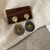 Pendientes Geométricos de Flor de Resina Transfronterizos Europeos y Americanos Otoplastias Maillard Otoño e Invierno Diseño Nicho de Gama Alta Joyería para Orejas Venta al por Mayor
