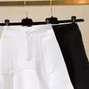 Falda de sirena de línea A de cintura alta para mujer Verano 2026 Blanca Estilo coreano Diseño de falda corta Traje con sentido del diseño Falda con volantes
