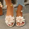 Sandalias de vacaciones de estilo bohemio europeo y americano para mujer, con correas de tobillo florales tridimensionales de color naranja y perlas, zapatos planos casuales, disponibles para venta transfronteriza