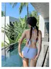 Traje de baño a rayas de alta gama transfronterizo para mujer, conjunto de cuatro piezas, estilo coreano Ins para resort de aguas termales