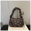 Bolso artístico de nicho estilo coreano con forma de estrella para las axilas para mujer, nuevo modelo 2026, bolso de un solo hombro plisado para el día a día con un toque de alta gama, bolso versátil para mujer