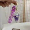 Llavero de Botella de Arena Líquida de Dibujos Animados, Pequeños Regalos para Puestos, Accesorios Acrílicos al por Mayor, Colgante Relleno de Aceite, Rasca Gatos Lindo de Regalo