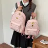 Mochila Temperamento 2026 Bolsa de Ombro Moda Grande Capacidade Nova para Deslocamento Estudante Aula Feminina Casual Tendência