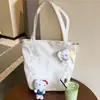 Bolsa de lona estilo japonés de alta calidad y elegante, perfecta para el uso diario, con gran capacidad, adecuada para estudiantes y viajeros, y se puede llevar como bolso de hombro.