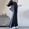Calça flare listrada para mulheres, novo modelo 2026, estilo fino para primavera e outono, calça flare casual preta de seda gelada para yoga tubarão