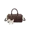 Bolsa de bolos de estilo retro de alta gama para mujer, colección de otoño 2026, bolso de hombro simple y moderno, nuevo bolso cruzado versátil