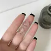 Super Hada Exquisito Lujo Ligero Mariposa Clip para Oreja Ear Cuff para Mujeres 2026 Nuevo Estilo Caliente Lujo Ligero Borla Colgante de Oreja Pendientes Venta al por Mayor
