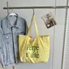 Bolsa de mano casual de nailon estilo coreano, bolso de mano de moda con estampado de letras, nuevo bolso de hombro de doble cara de verano para mujer