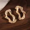 Pendientes Metálicos Exagerados de Forma Irregular de Gota de Agua Europeos y Americanos para Mujer Pendiente de Flor de Ola de Industria Pesada de Nicho Accesorio de Concha de Pulpo Venta al por Mayor