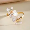 Pulseira de braço torcido com flor gota de óleo estilo metálico europeu e americano, pulseira de pulso única e doce, joia transfronteiriça de nicho de alta qualidade