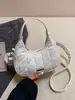 Bolsa Meia-Lua Jeans Acolchoada Única para Mulheres 2026 Nova Tendência Retro Bolsa de Ombro Transversal Bolsa de Mão Fashion Versátil