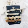 Clip de gelatina hueco nuevo de primavera y verano versión coreana para la parte de atrás de la cabeza con forma de nube ola temperamento clip para el pelo simple traje de montaje