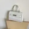 Bolso Pequeño de Textura de Alta Gama para Mujer 2025 Nuevo Verano Versátil Bolso Cruzado Exquisito Mini Bolso de Hombro de Moda Bolso Kelly