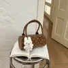Bolso de Mano Pequeño Shuai Mi Jia para Mujer 2026 Nuevo de Principios de Otoño Moderno Elegante Bolso de Hombro de Nicho para Viajes Diarios Bolso Cruzado