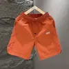Shorts masculinos, calças de comprimento médio para o verão de 2026, marca da moda, respiráveis, soltas, finas, calças casuais de cintura média para homens