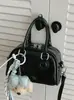Bolso de mujer de diseño de nicho de alta gama transfronterizo, bolso de bolos, nuevo modelo 2026, un solo hombro, bandolera, bolso de mano, moderno