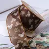 Estampado de cabeza de ratón de dibujos animados cinta de gasa lazo DIY accesorios para el cabello flores regalo horneado empaque de pastel