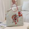 HINEZHA Moda de celebridad de Internet bordado de tendencia bolsa de compras de nailon transfronteriza casual para todo combinar bandolera para ir al trabajo