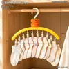 Colgador multi-clip con forma de caqui para ropa de bebé, tendedero y organizador para ropa interior y calcetines de uso doméstico