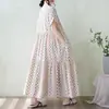 Foto real de vestido de algodón 2026 talla grande de verano estampado holgado adelgazante de manga corta con un ambiente artístico y relajado