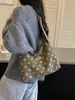 Bolsa casual de lunares de alta calidad para mujer 2026 nueva bolsa de mano de gran capacidad versátil para ir al trabajo bolsa de un solo hombro para el antebrazo