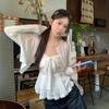 Toma real primavera y verano 2025 nuevo cárdigan de punto blanco estilo coreano dulce y picante traje de tirantes de hermanita dulce mujer