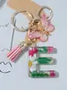 Suministros del Fabricante Llaveros con Flores Secas Prensadas 26 Letras del Alfabeto Inglés Llaveros con Borla de Mariposa Charms para Bolsos de Mujer