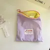 Bolsa de maquillaje portátil para viajes, bolsa delgada de color macarrón para guardar labiales y cosméticos, alto valor estético, bolsa simple con cremallera