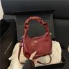 Bolso de Mano de Lujo, Elegante y de Moda, Nuevo para Verano 2026, Plegado, Versátil, con Cadena de Nube, Bolso de Hombro Cruzado