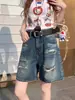 Jeans vintage lavados desgastados azul mujer 2025 verano nuevo diseño con sentido rotos holgados shorts combinables