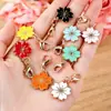 Venta Caliente Transfronteriza Aleación Esmalte Flor de Cerezo Colgante Broche Universal DIY Ropa Llavero Bolso Collar Pendientes Accesorios