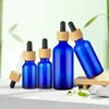 Botellas de aceite esencial azules al por mayor, disponibles en varios tamaños, con tapas gotero resistentes a la luz, botellas vacías para sueros y botellas dispensadoras cosméticas portátiles