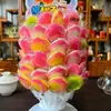 Paletas y Caramelos Duros en Varias Formas de Frutas para que los Niños Compartan Dulces y Den a sus Amigos Regalos Navideños. Puestos en la Puerta de la Escuela