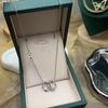 Collar de acero de titanio hueco de doble anillo estilo coreano, trébol de cuatro hojas, moda versátil, doble botón, trébol de la suerte, acero de titanio, joyería con retención de color para mujer
