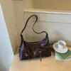 Bolsa de Ombro Feminina Xiaomi Estilosa para Mulheres que se Deslocam Verão 2026 Nova Bolsa Simples Formato Bolinho Bolsa de Ombro Única Retrô