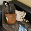 Bolso de mano casual de estilo coreano 2026 para mujer, diseño simple de lazo, para niñas, de un solo hombro, cruzado, para debajo del brazo