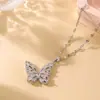 Collar de mariposa súper llamativo de moda francesa con circonio completo de acero y titanio para mujer, ligero, de lujo, nuevo estilo cibernético popular, elegante y exquisita cadena de clavícula.
