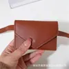 Bolsa Feminina 2024 Novo Estilo Fashion Mini Bolsa de Cintura Decorativa com Cinto Elegante Pequena Bolsa Ins Versátil Bolsa de Cintura Porta-Cartões
