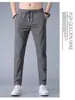 Fabricante transfronterizo de comercio exterior al por mayor de pantalones deportivos casuales de verano de talla grande de secado rápido para hombre, pantalones rectos holgados transpirables de seda de hielo