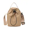 Bolsa pequeña de nailon estilo japonés para mujer, nuevo modelo 2026, bolsa simple y versátil para teléfono con cordón, bolsa de hombro cruzada ligera para exteriores