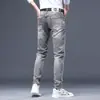 Temporada de primavera y otoño, pantalones de mezclilla grises para hombre, elásticos, modernos, corte ajustado, pierna cónica, estilo europeo, con estampados únicos, pantalones largos casuales