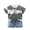 Conjunto de Verano para Niños 2026 Modelo Nuevo Conjunto Delgado de Verano para Bebés y Niños con Mangas Cortas de Rayas Anchas y Auriculares Conjunto de Dos Piezas Venta al por Mayor