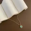 Colar, uma peça luxuosa de aço titânio com um pingente oval de pedra olho de gato 18k, uma corrente moderna e elegante, uma popular corrente de clavícula de aço inoxidável