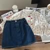 Ropa Infantil Estilo Coreano 2026 Nuevo Set de Tres Piezas para Niñas Cardigan Tejido de Lunares y Falda Corta de Mezclilla Elegante Tendencia
