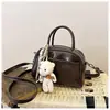 Bolso de mano vintage marrón de alta gama transfronterizo para mujer, nuevo y elegante bolso cruzado versátil 2026, bolso para teléfono