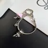 Colgante de hongo estilo Ins con goteo de aceite, cadena de teléfono de hueso de serpiente, llavero nuevo creativo de pedrería, accesorio para bolso