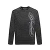 Camiseta de Manga Larga a Rayas para Hombre Primavera Otoño Bordado Floral Letras Cuello Redondo Camiseta Top Personalidad Holgada Casual INS Tendencia